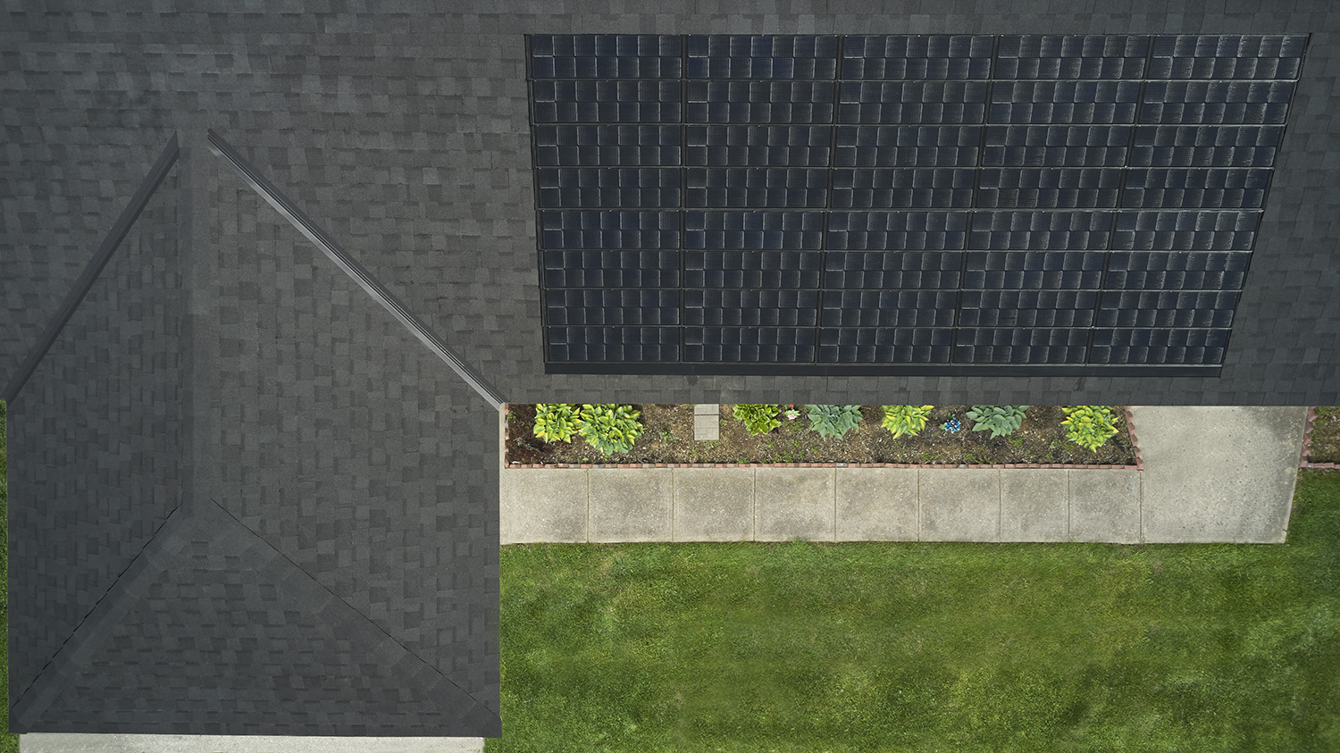 A home with CertainTeed Solstic shingles installed on it