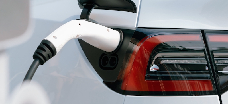 electric vehicle charger plugged into car