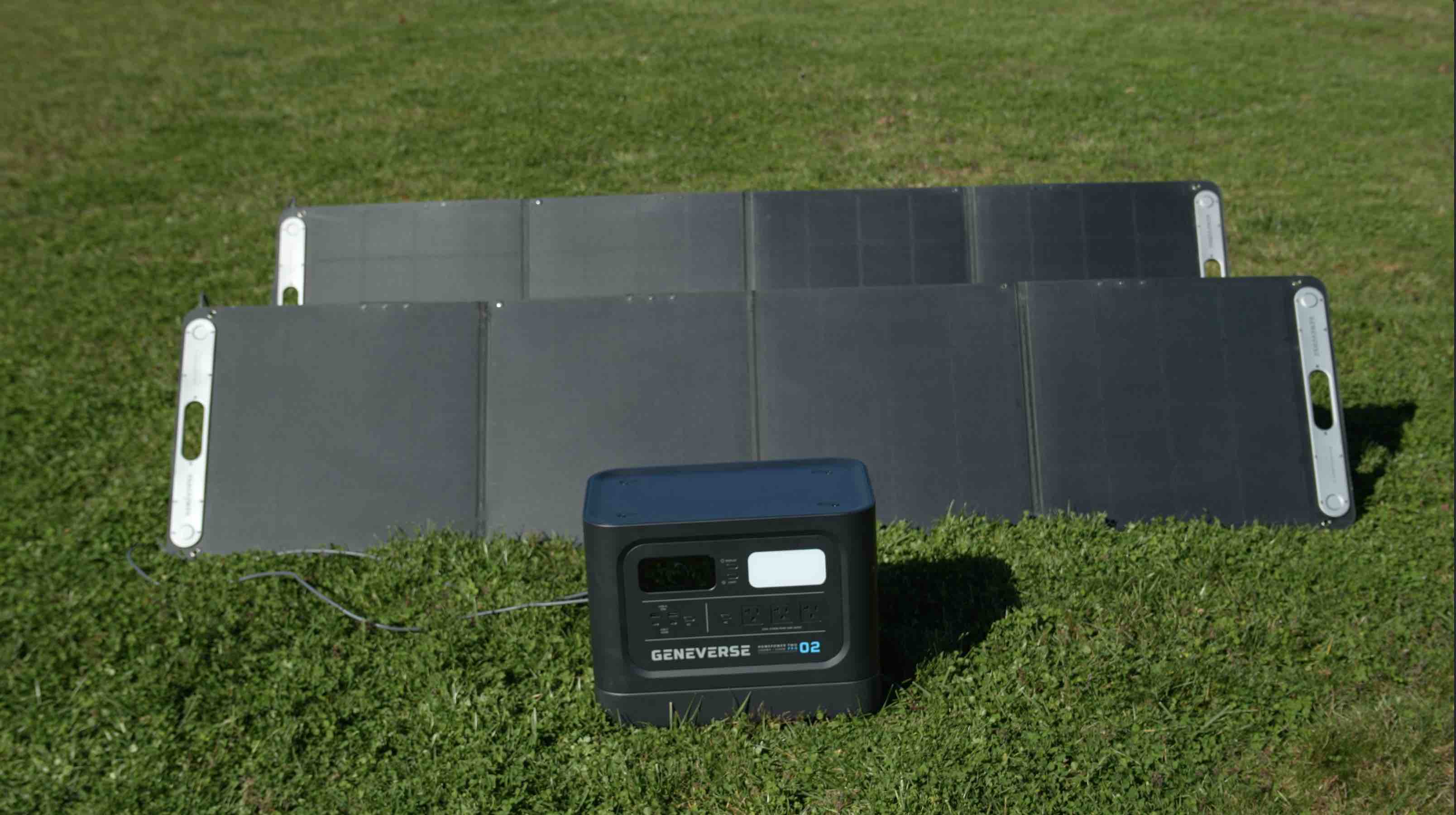 A Geneverse solar generator with two solar panels in a sunny field