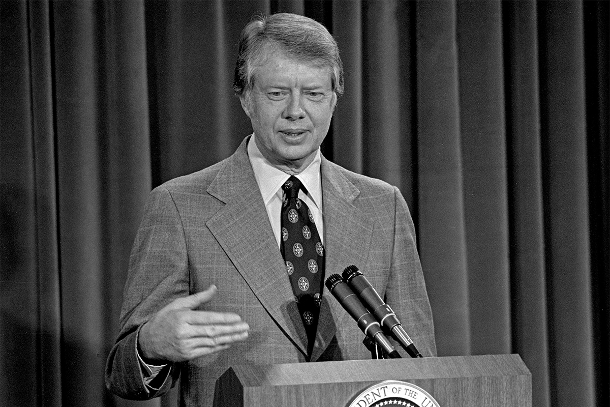 President Jimmy Carter giving a speech at a podium